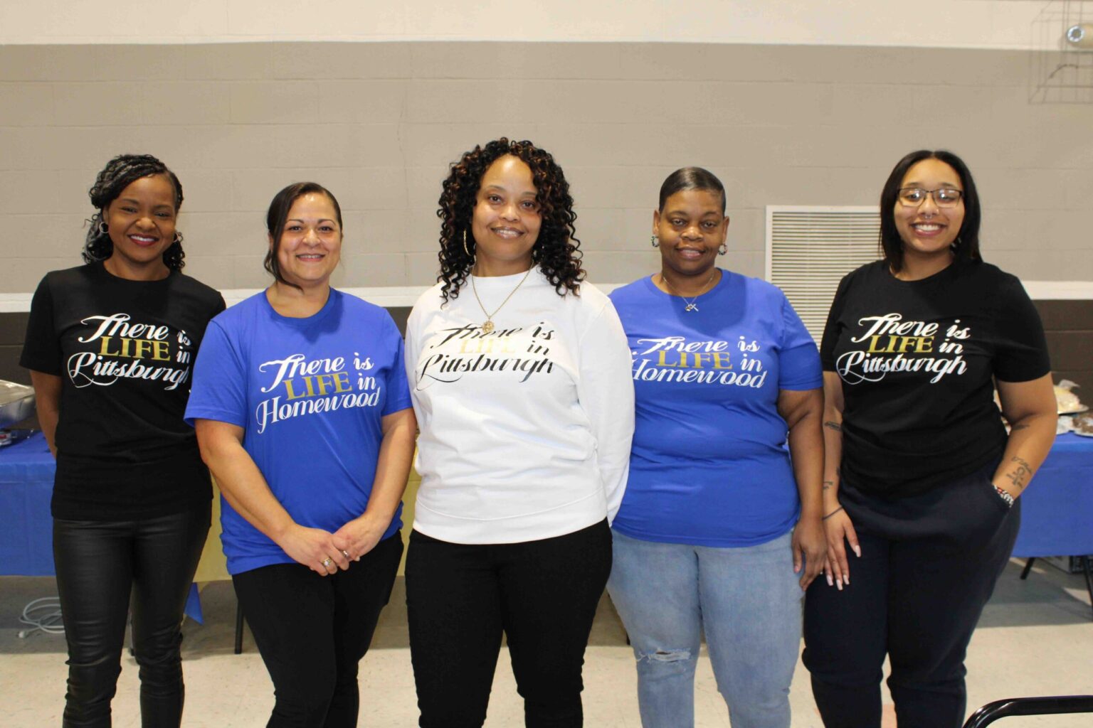 Women in matching "There is Life in Pittsburgh" shirts