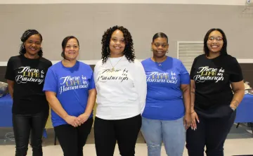 Women in matching "There is Life in Pittsburgh" shirts